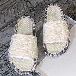 APL NEW IN BOX SLIDES . WOMENS SIZE 7